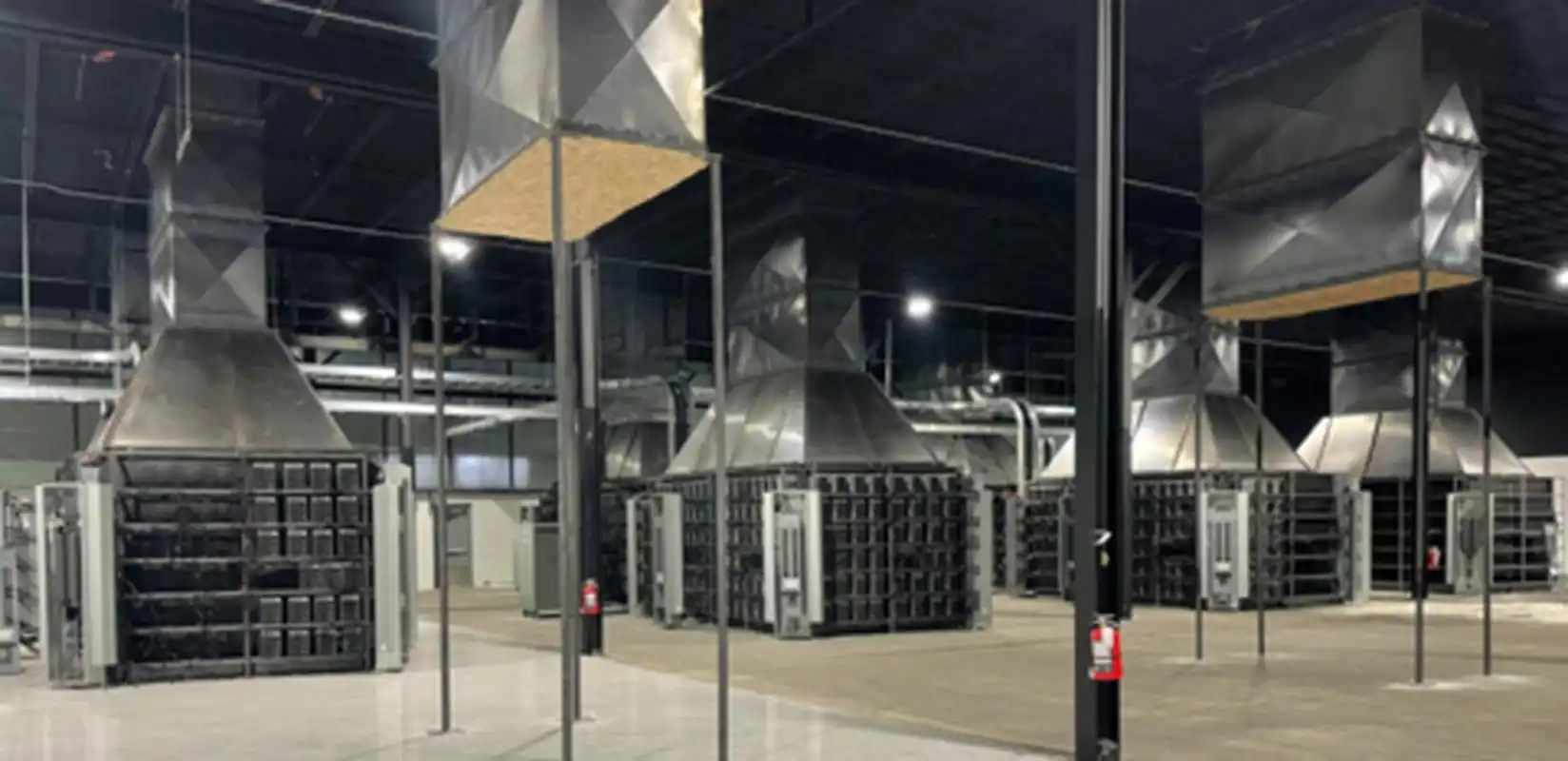 A large-scale mining farm featuring hundreds of mining machines under warranty coverage